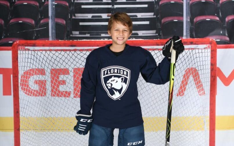 Student playing hockey