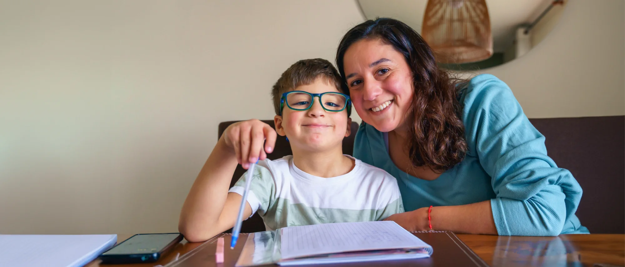 Mother and son doing homework together
